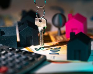 money, calculator, and a house key